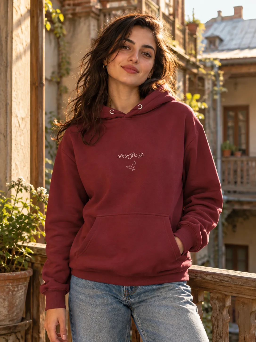 Woman wearing the wine-red Araushavs Bird Hoodie